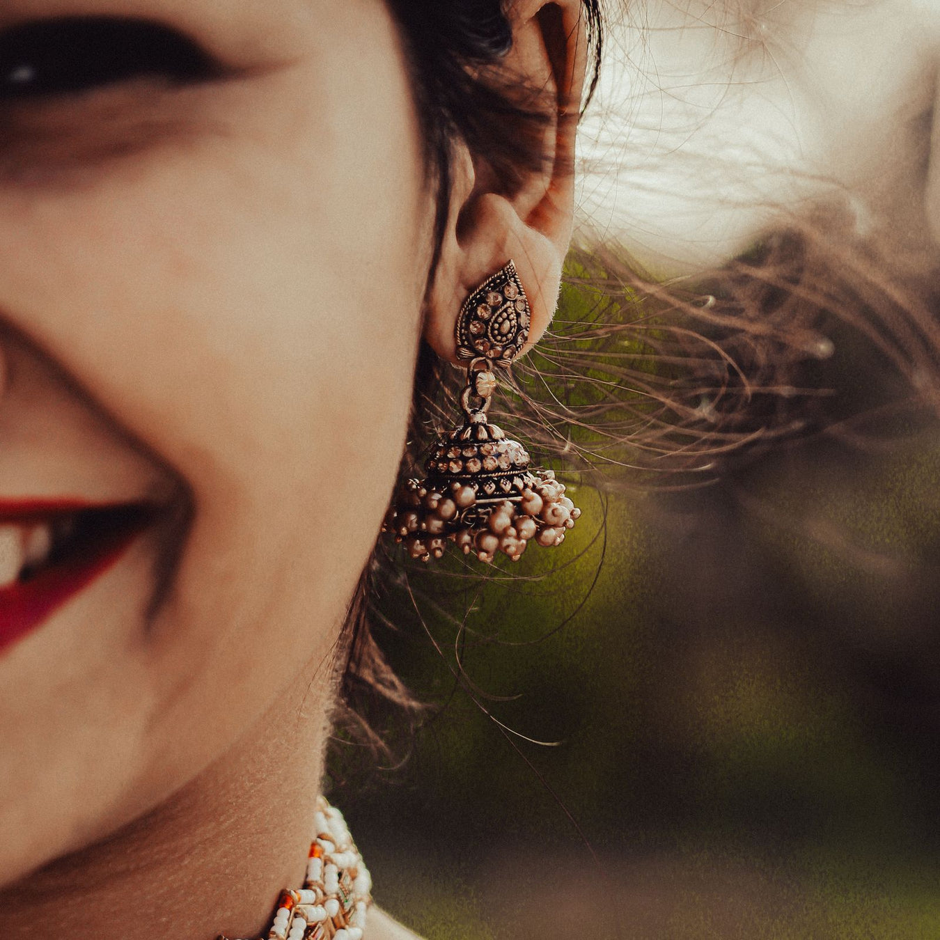 Close-up of woman wearing earrings - women's accessories