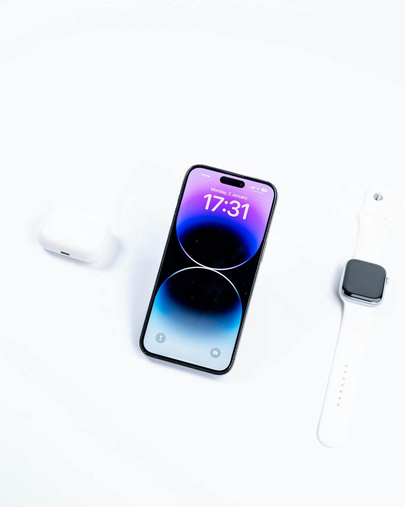 Tech gadgets and accessories on white surface
