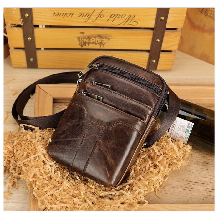 Angled view of the TC2014 leather waist bag showing the three front zip pockets - Touch and Catch NZ