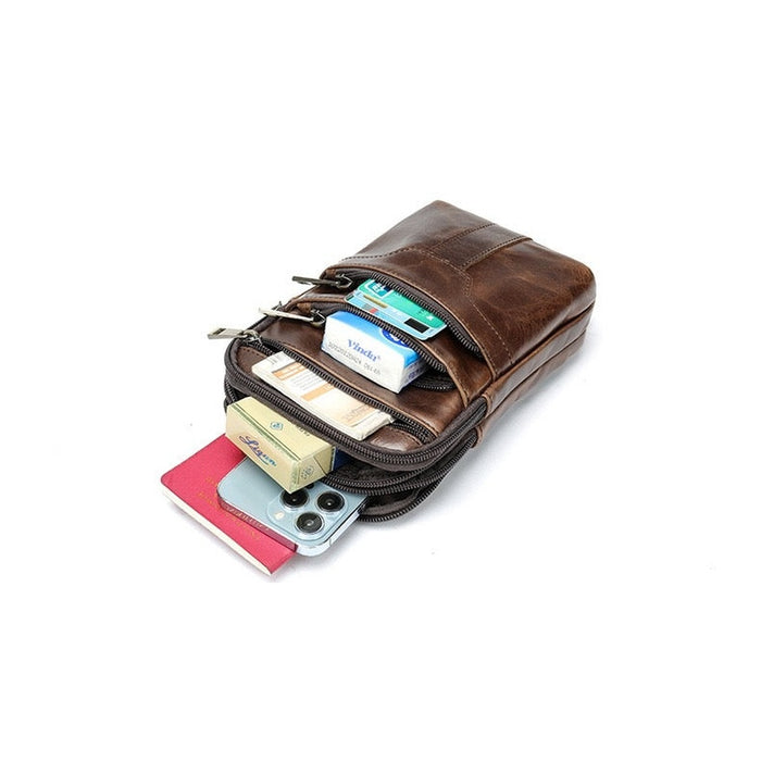 TC2014 waist bag packed with a passport, smartphone and cards showing its five compartments - Touch and Catch NZ