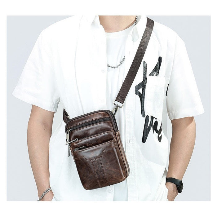 Man wearing the TC2014 leather bag crossbody over a white shirt - Touch and Catch NZ