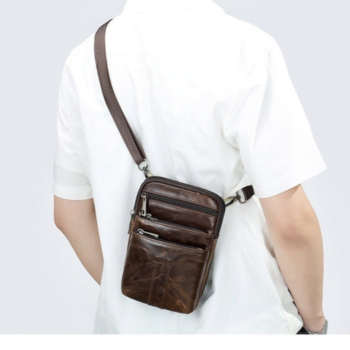 Back view of a man wearing the TC2014 leather crossbody bag - Touch and Catch NZ