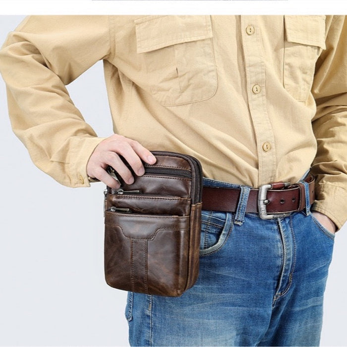 TC2014 leather waist bag being opened while clipped to a belt at the hip - Touch and Catch NZ