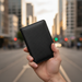 Carbon fiber RFID passport wallet TC312 held in hand on Auckland street