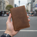 Genuine leather RFID passport wallet TC336 held in hand on Auckland street