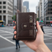 Genuine leather wallet TC3449 held upright in hand on Auckland city street
